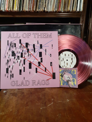 Translucent Pink vinyl with Front cover of ALL OF THEM Vinyl in sleeve in front of record player with Lyric Zine/Coloring book